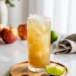 Apple mocktail in chilled glass with mint garnish
