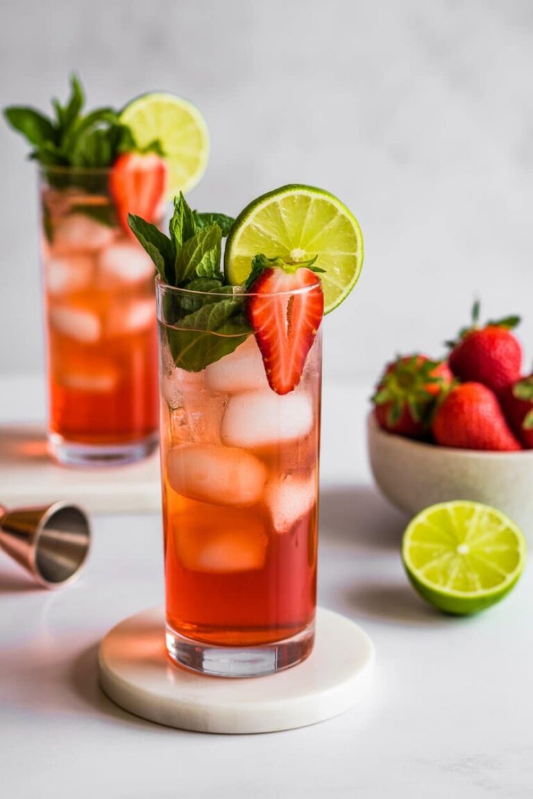 Close-up of strawberry mojito mocktail with mint, strawberries, and lime