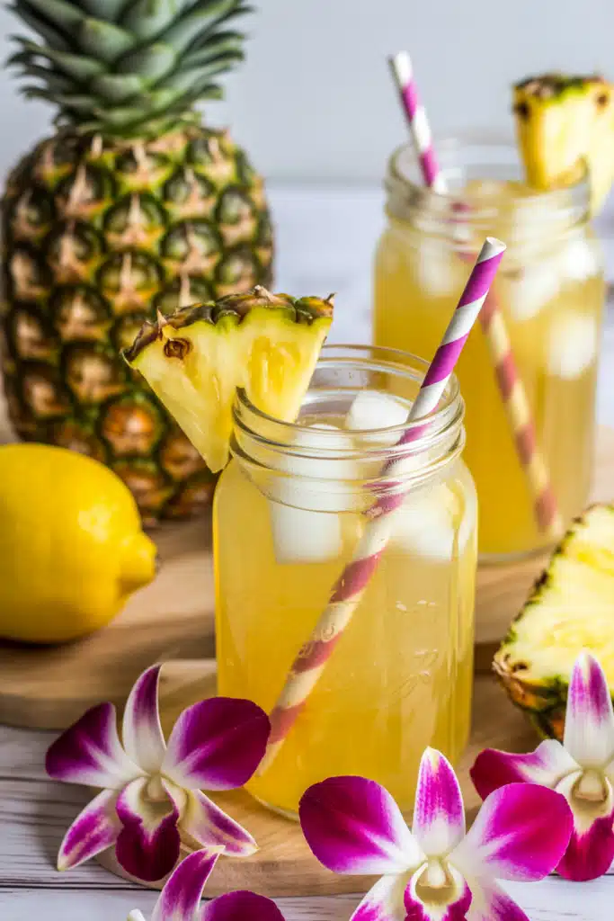 Close-up of pineapple lemonade with pineapple and lemon garnish